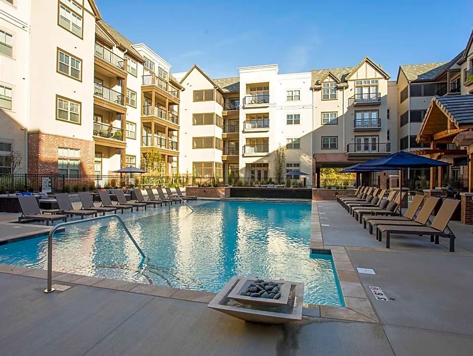 Mission 106 Luxury Apartments large resort-style pool, courtyard, and sun deck lounge area